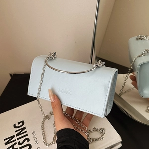 Light blue mini flap bag with silver ring handle and chain strap for spring 2025