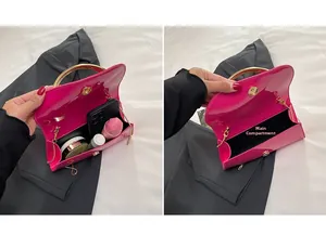 Internal view of the magenta patent leather handbag showing the main pocket capacity