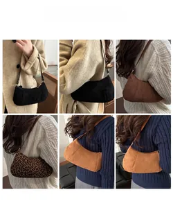 Detail view of suede half-moon baguette bags in black brown camel and leopard print