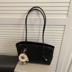 Large black leopard print flocking tote bag with slim shoulder straps and plush charm