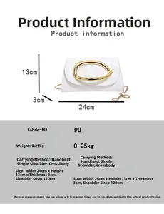 Detail view of white PU leather crossbody bag with large gold metal handle and chain strap