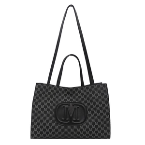 Chic black tote bag with letter M print and circular embossed logo for daily commuting