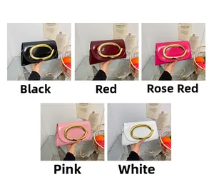Detail showing five colors of patent leather chain bags with gold oval buckles