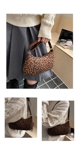 Detail of leopard print shoulder bag featuring velvet texture and brown leather strap