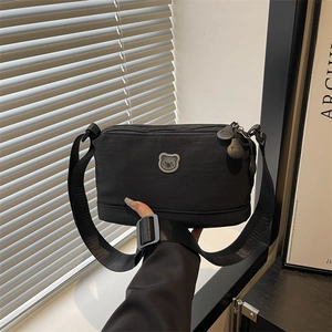 Chic black nylon crossbody bag with cute bear badges and three zipper layers
