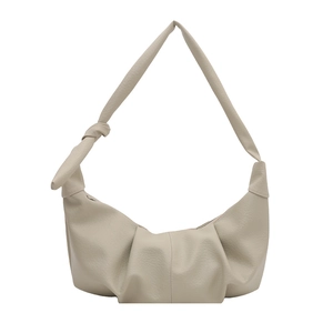 Minimalist beige pleated crescent shoulder bag with knot strap detail and pebble texture