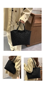 Detail of high-capacity leopard print tote bag styled with a khaki trench coat