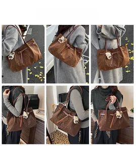 Brown leopard print tote bag styled with brown straps and cute kitten plush charm