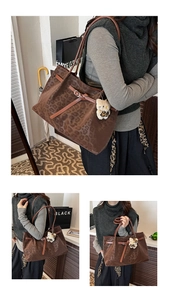 Close-up of leopard print tote bag with brown leather straps and cute plush bear charm