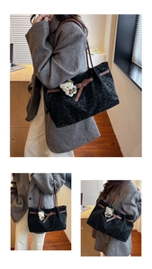 Detail view of leopard print tote bag with brown leather straps and plush bear charm