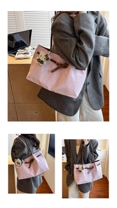 Detailed close-up of pink leopard jacquard tote bag with leather straps and plush charm