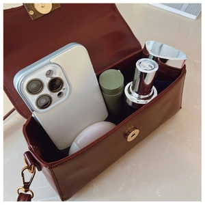 Interior view of vintage matte crossbody bag showing large capacity and golden clasp