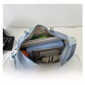 Large travel bag interior showing high capacity for laptop, tablet and clothes