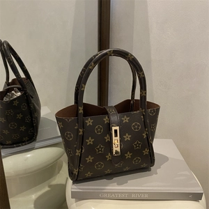 Classic dark brown printed tote bag with star pattern and golden metal buckle clasp