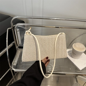 Minimalist beige woven straw shoulder bag with elegant V-shaped wavy texture for women