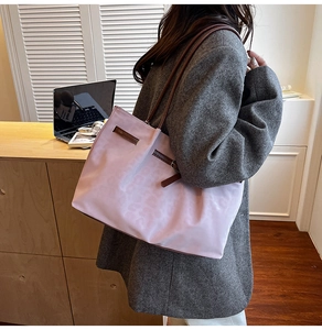 Detail of light purple tote bag with premium leather straps and buckle for daily commute