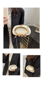 Three-way view of white lychee leather half-moon bag with large golden C-ring buckle