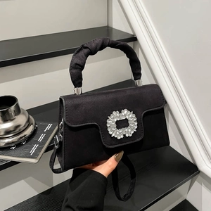 Chic black suede handbag with crystal buckle and scrunchie handle for party evening use