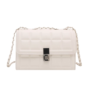 Chic beige quilted square handbag with silver metal lock and classic chain strap