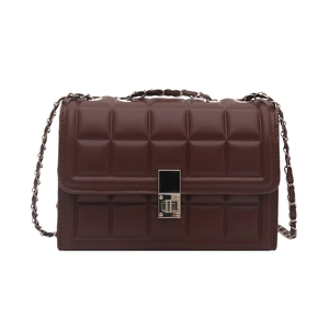 Deep brown quilted crossbody bag with stylish chain strap and metallic clasp on white background