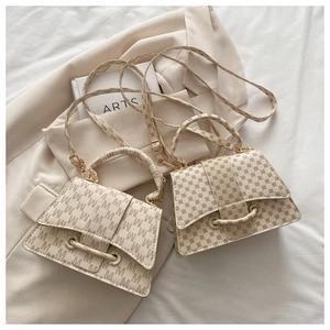 Detailed comparison of two cream textured square handbags with elegant letter prints