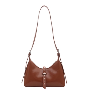 Chic brown glossy leather shoulder bag with vertical rivet details and silver hardware