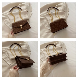 Macro views of brown leopard print crossbody bag with golden chain and U-shaped metal lock