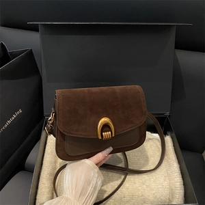 Vintage dark brown crossbody bag with gold horseshoe buckle in a premium gift box