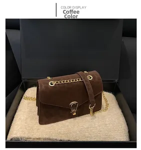 Detail of coffee leopard print bag with gold chain strap in a premium gift box setup