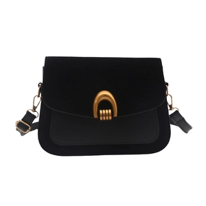 Chic black flap shoulder bag with gold horseshoe buckle and suede leather paneling