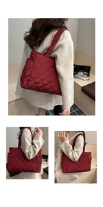 Detail of burgundy quilted tote bag with side pocket and lightweight padded texture
