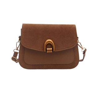 Vintage brown leather crossbody bag with horse-bit buckle and adjustable strap