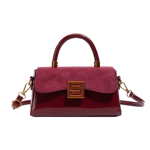 Burgundy matte and patent leather shoulder bag with gold square buckle and top handle
