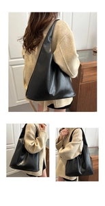 Three-way view of a minimalist large black leather tote bag on model's shoulder