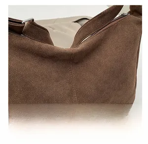 Close-up of the premium brown suede texture and durable stitching on this large tote bag