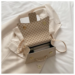 Detail view of large capacity crossbody bag interior with printed geometric pattern