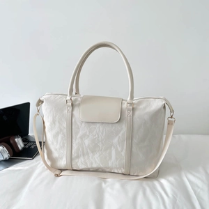 Large capacity cream white travel bag with pleated texture and adjustable shoulder strap