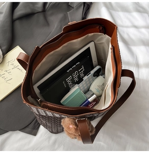 Top view of large woven tote bag interior showing capacity for tablets and cosmetics