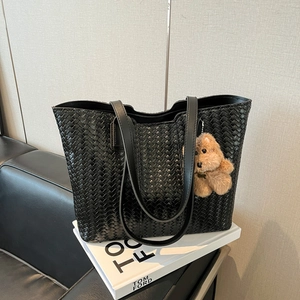 Large capacity black woven tote bag with a cute plush bear pendant for daily commute