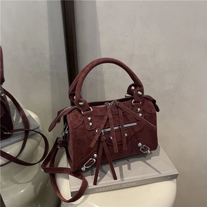 Retro burgundy suede moto-style handbag with silver rivets and long tassel details