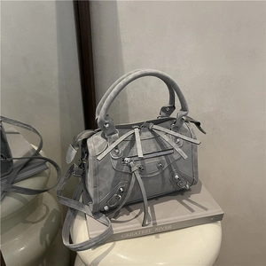 Retro grey suede rivet handbag with leather tassels in a stylish biker-style design