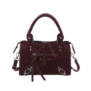 Deep red suede crossbody bag featuring retro rivets and classic motorcycle style design