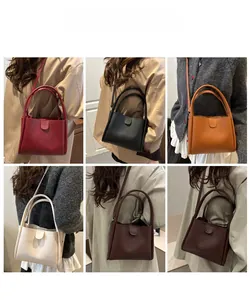 Six colors of minimalist leather bucket bags shown from behind on a fashion model