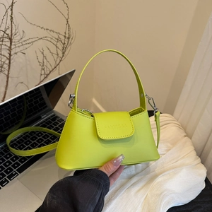 Chic fluorescent green French baguette bag with top handle and crossbody strap