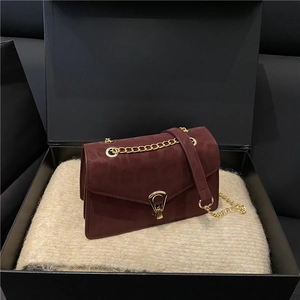 Elegant burgundy leopard embossed crossbody chain bag in a luxury gift box packaging