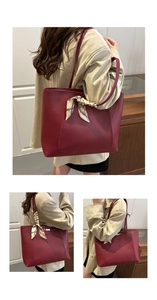 Detail of dark red retro tote bag with vintage printed silk scarf on handle