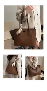 Macro detail of brown leather tote bag showing metal trim, front pocket, and floral scarf
