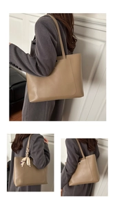Detail of khaki tote bag featuring outer pocket, soft leather texture and silk scarf