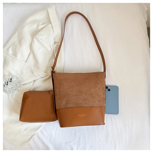 Detailed top view of a brown two-piece bucket bag set with contrast textures