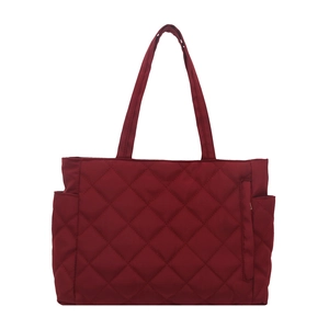 Deep red quilted tote bag with multi-pocket design and long shoulder straps for women